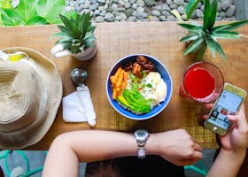 Woman Holding Iphone While Eating